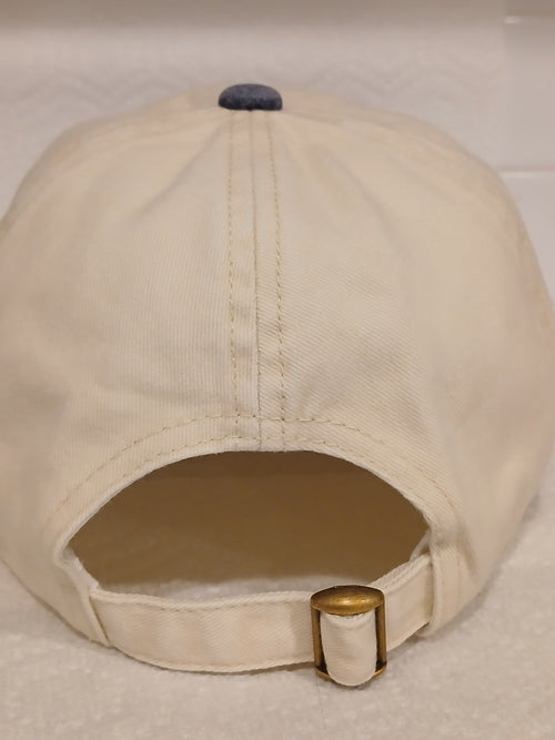 Back of Beige and Blue Hat